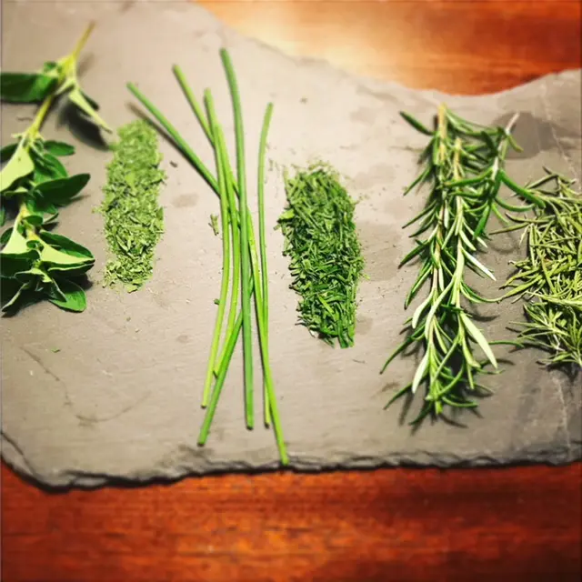 variety of herbs on platter