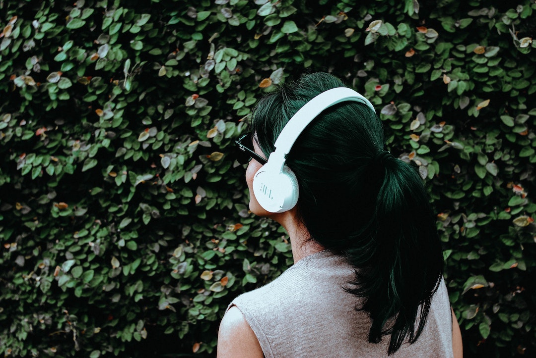 girl walking with headphones