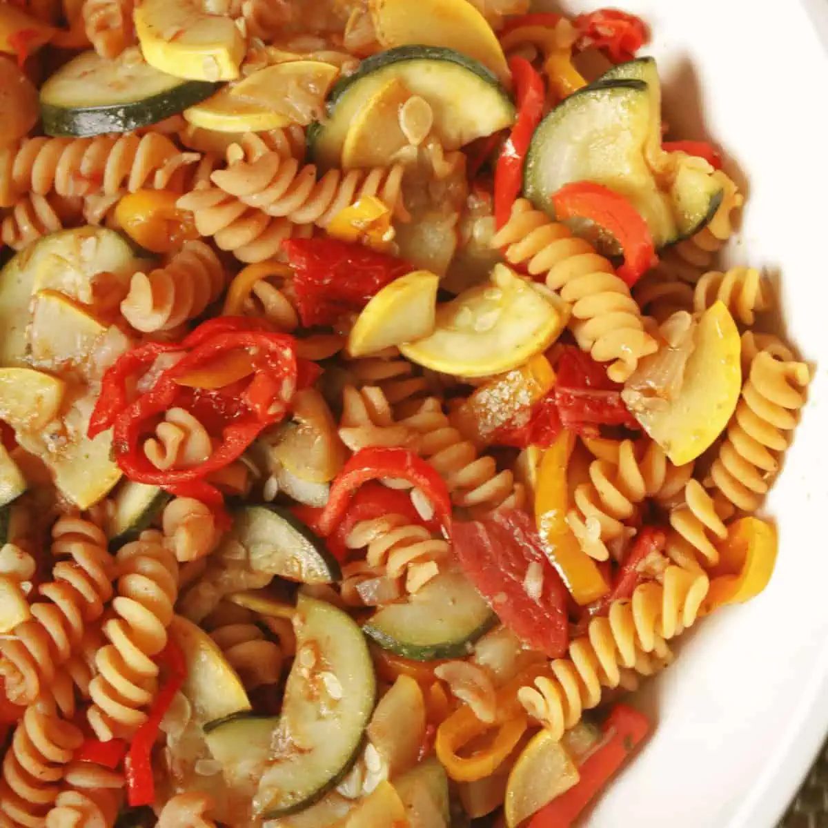 overhead image of chickpea pasta with summer veggies