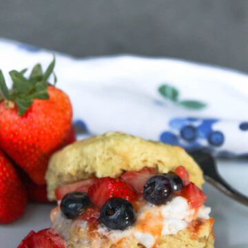 Strawberry shortcake with blueberries on plate | hearth health happiness