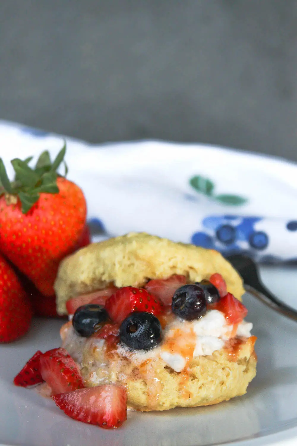 Strawberry shortcake with blueberries on plate | hearth health happiness