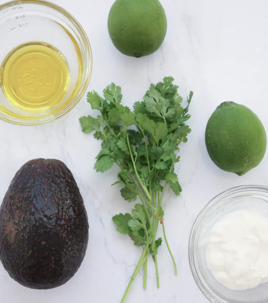 flatlay shot of ingredients for avocado cilantro lime salad dressing | hearth health happiness