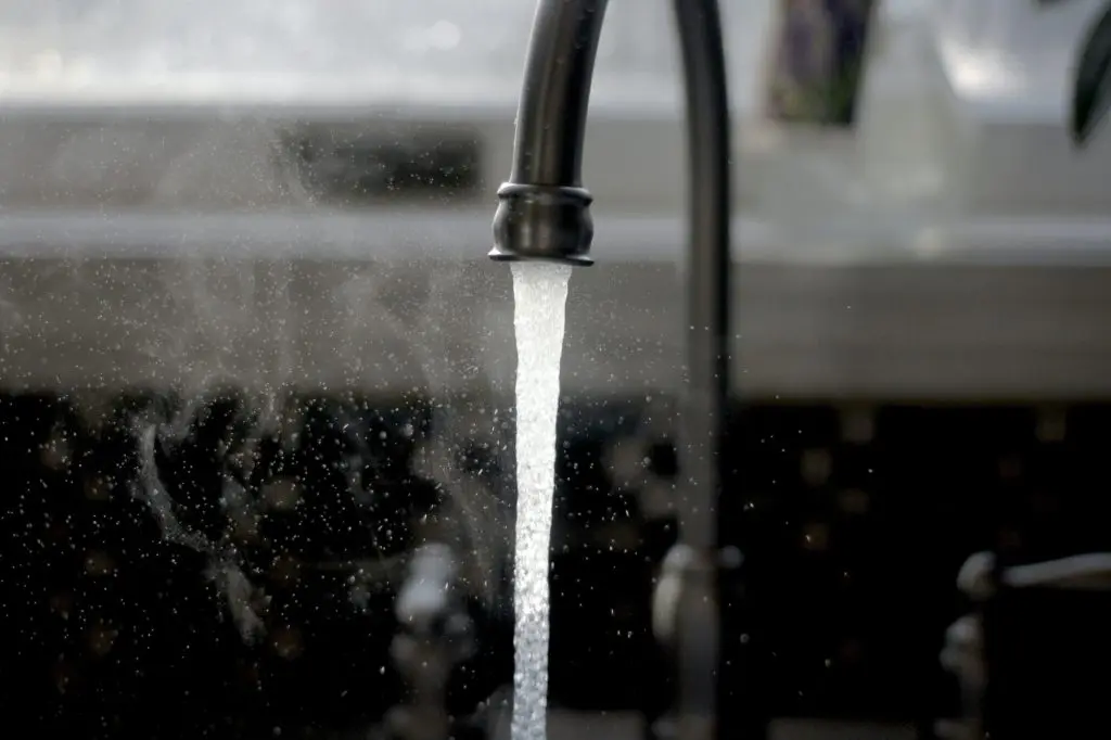 water pouring from faucet | Photo by Imani on Unsplash | hearth health happiness