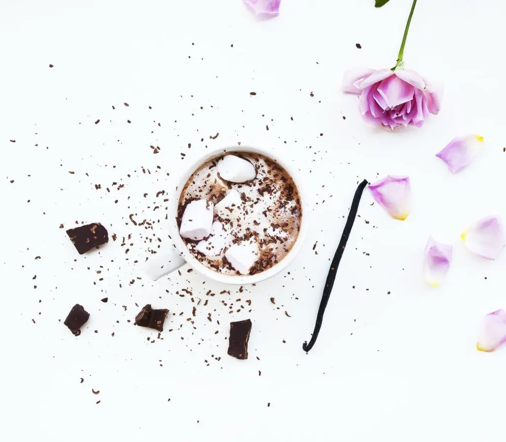 Flatlay of coffee with marshmallows, chocolate, and vanilla bean pod | Photo by Magda Fou on Unsplash | hearth health happiness