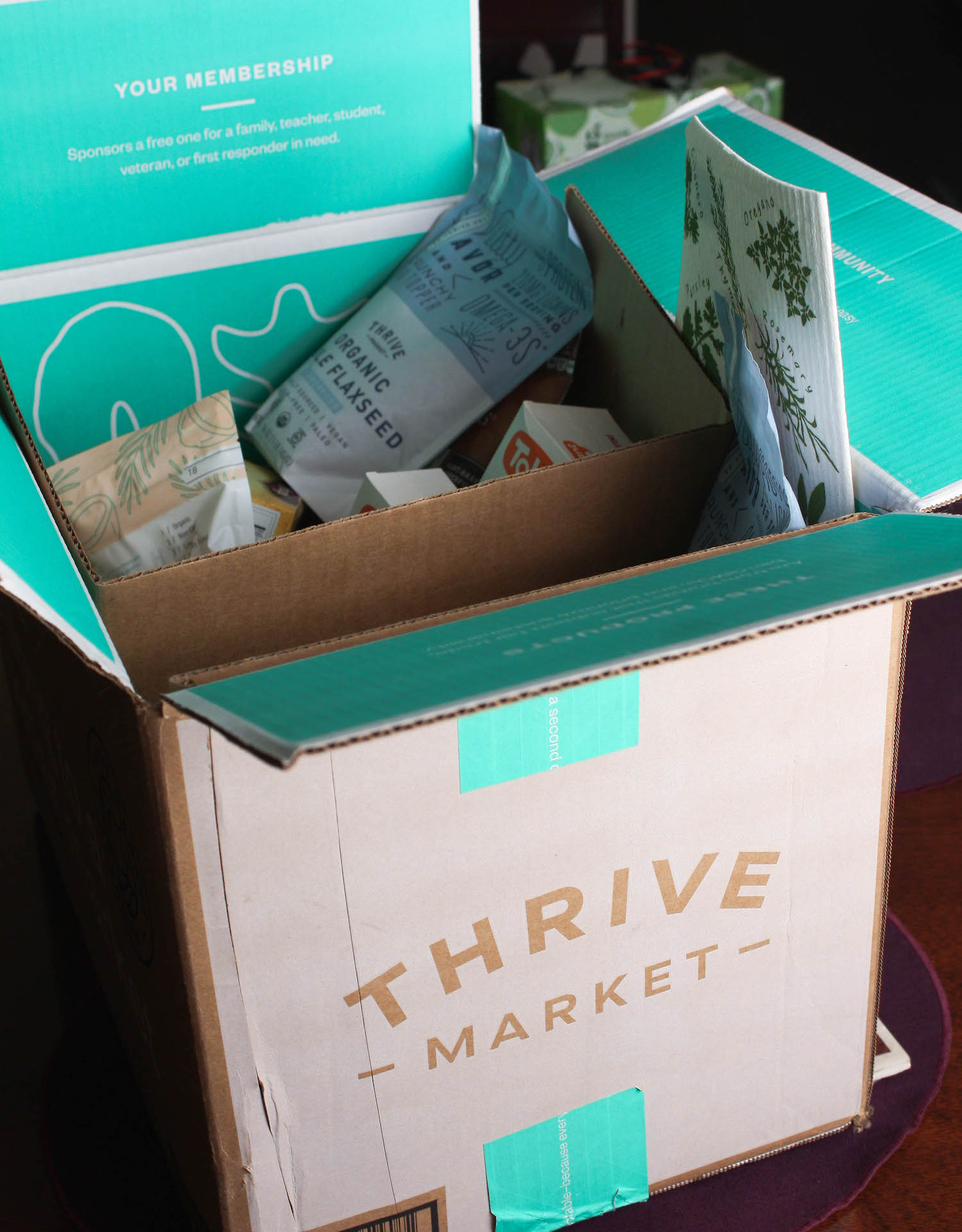 thrive market box with a few contents showing | hearth health happiness