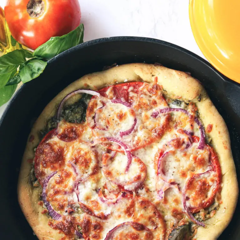 overhead image of baked cast iron pizza in skillet