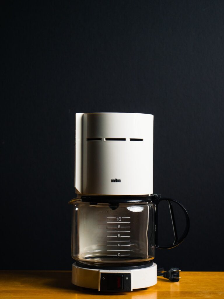 coffee maker | Photo by Ronan Furuta on Unsplash | spring cleaning