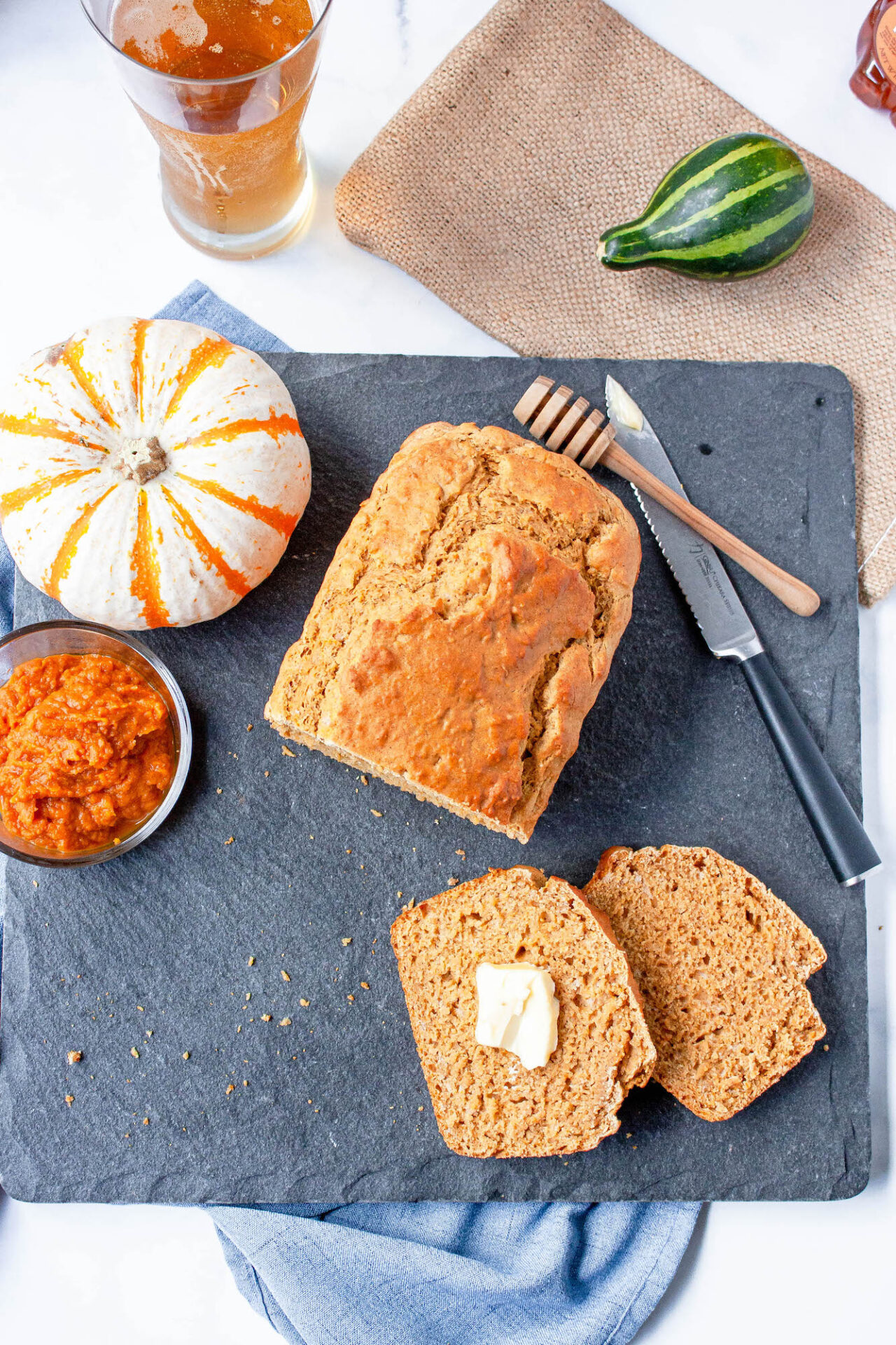 overhead image of pumpkin beer bread loaf with slices | food blog | hearth health happiness