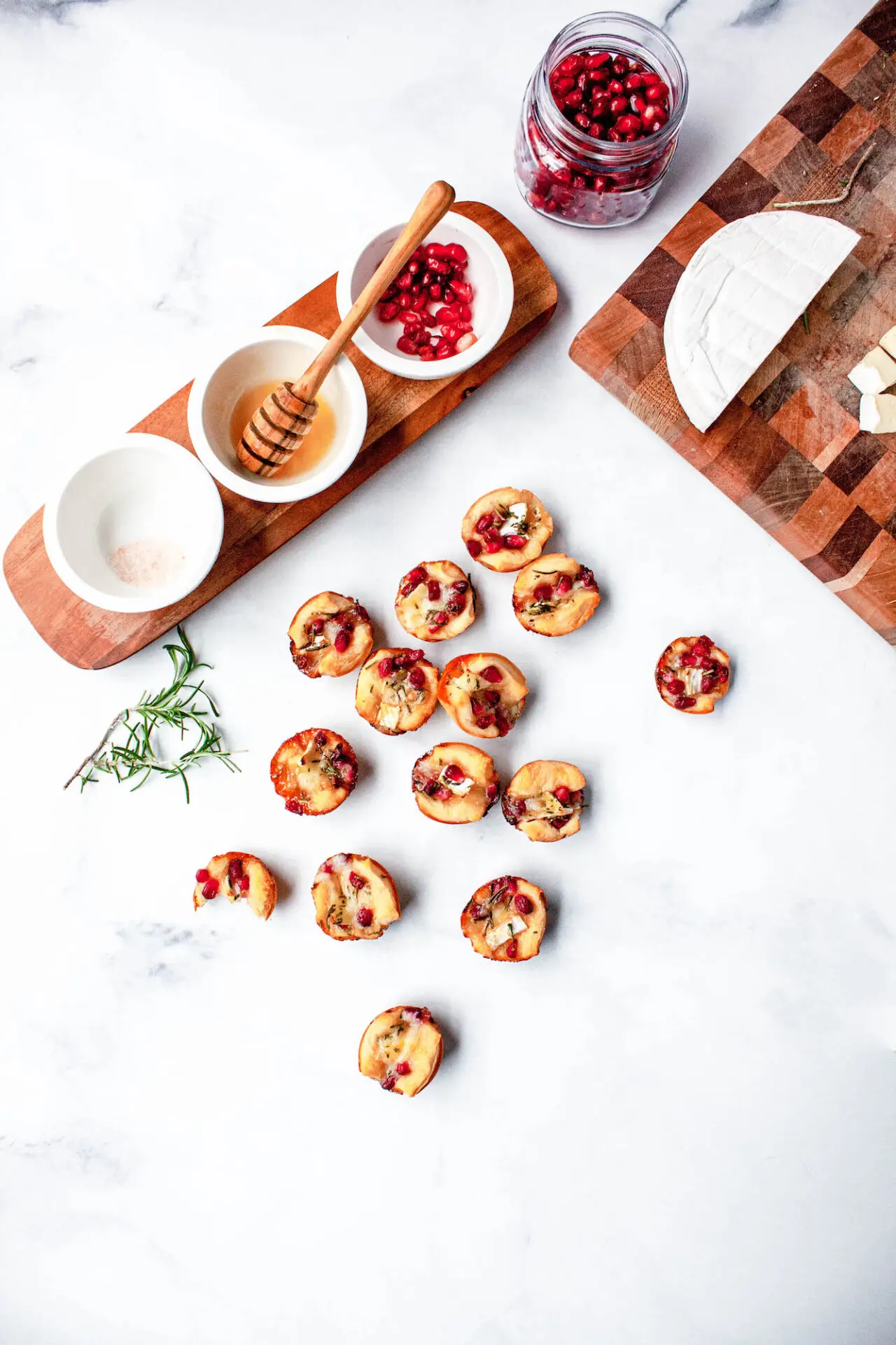 flatlay of pomegranate rosemary Brie bites | comfort food | hearth health happiness