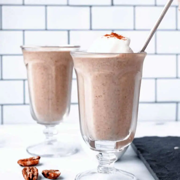 side angle image of pecan pie smoothies in glasses on counter