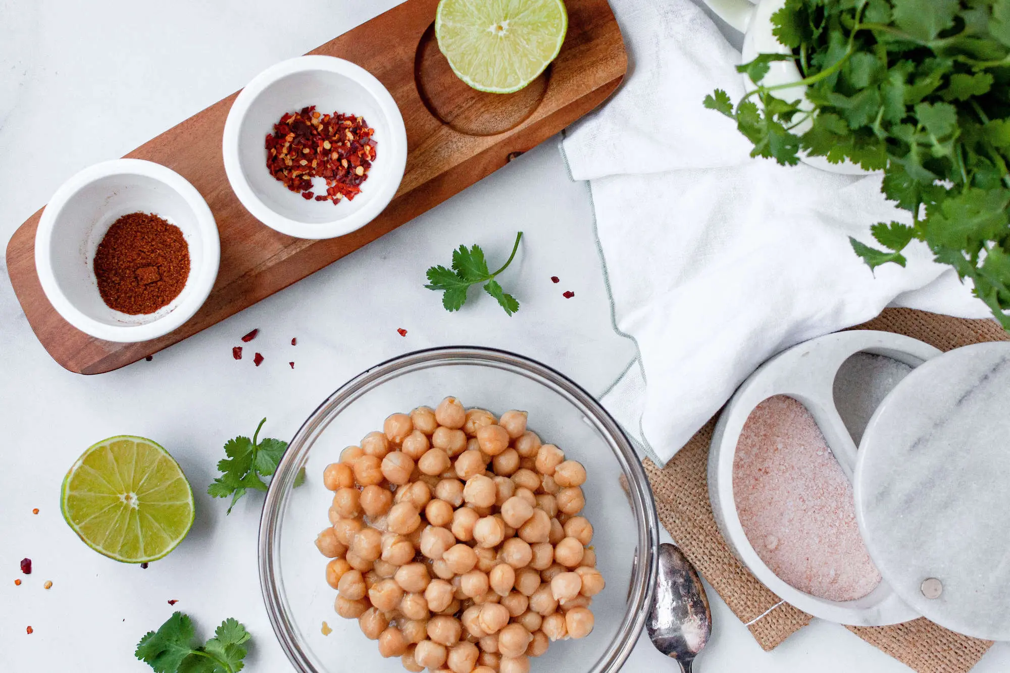 overhead image of plain chickpeas with the seasoning ingredients | hearth health happiness