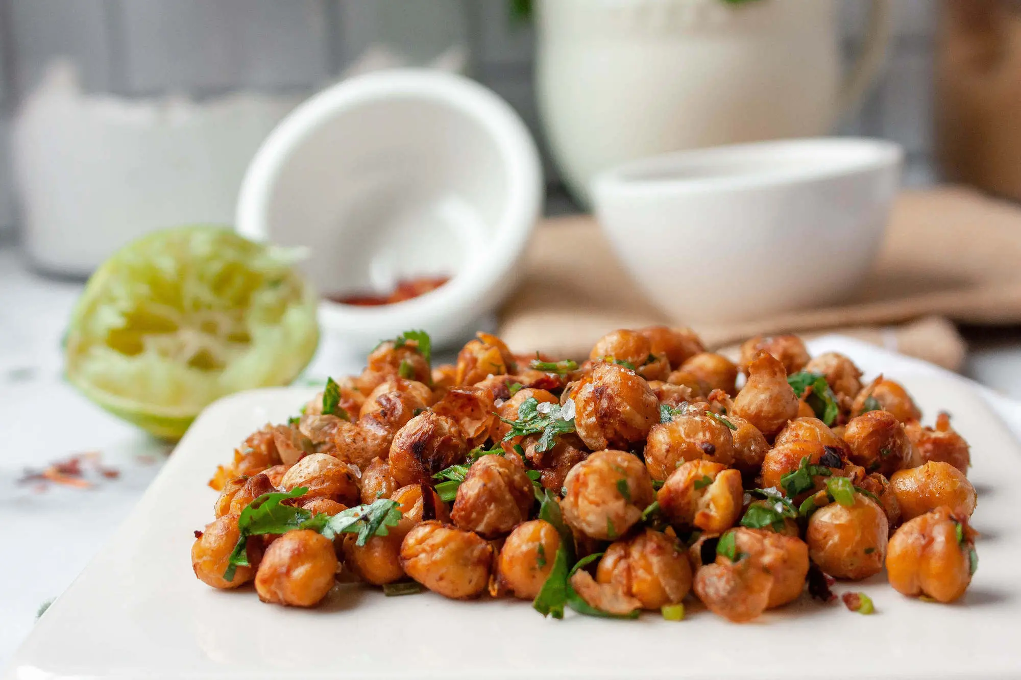 side angle shot of chili lime roasted chickpeas on serving plate