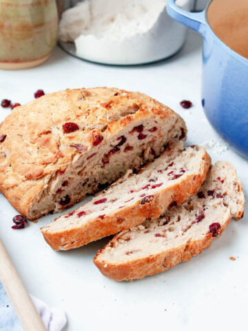cranberry boule bread sliced on counter