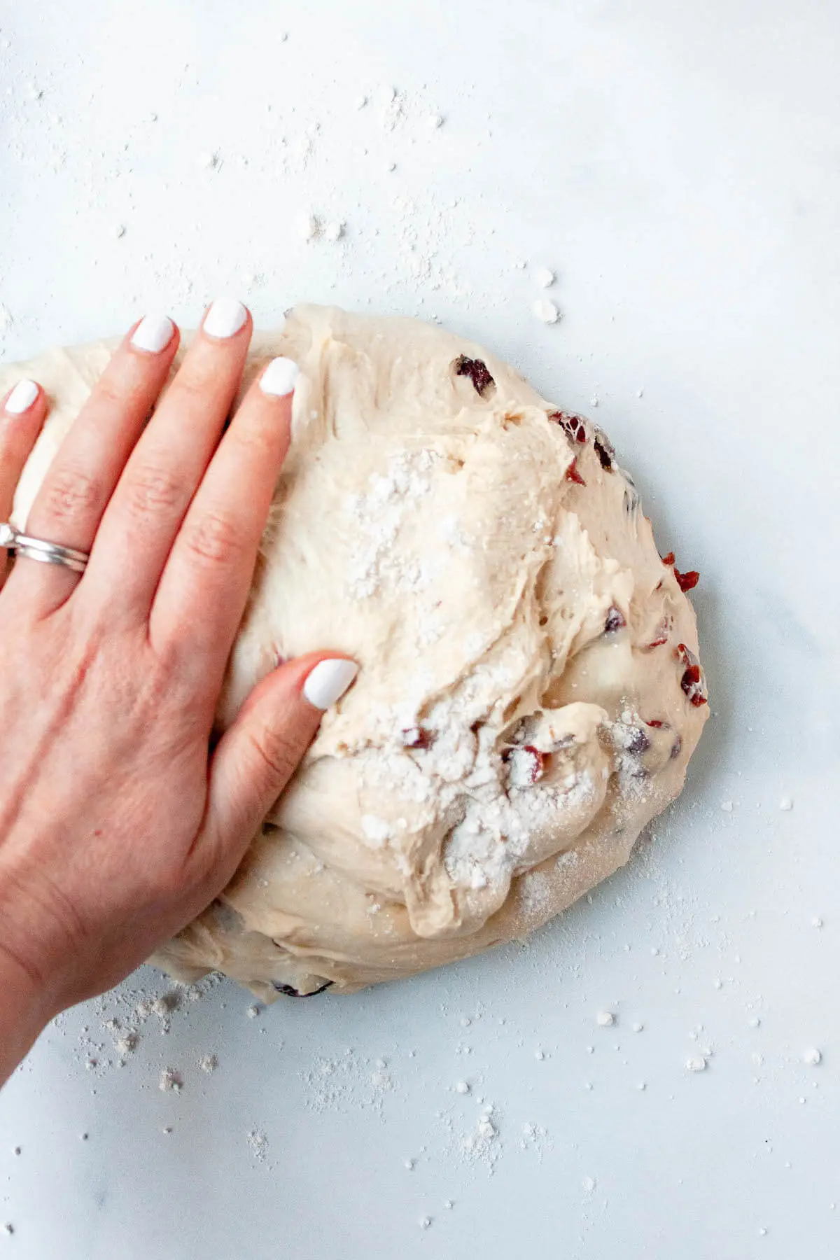 cranberry boule bread kneading on counter