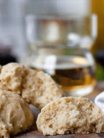 beer biscuits on counter with glass of beer in background
