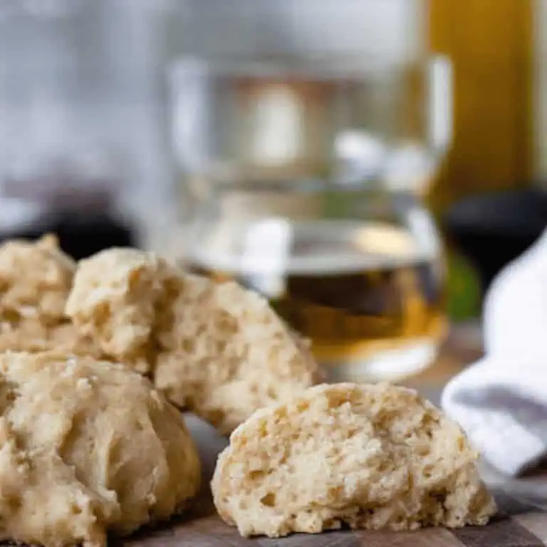 beer biscuits on counter with glass of beer in background
