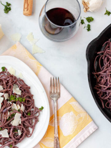 gluten free red wine pasta on counter with scattered ingredients