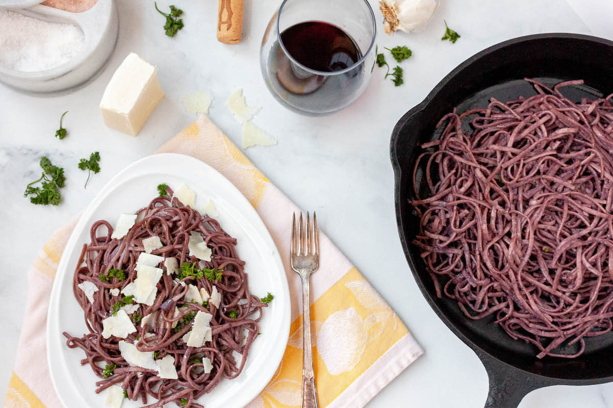 gluten free red wine pasta on counter with scattered ingredients