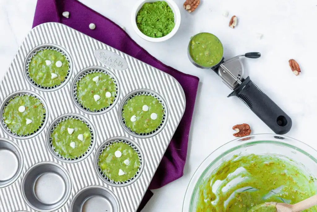 matcha muffin batter in cups before baking