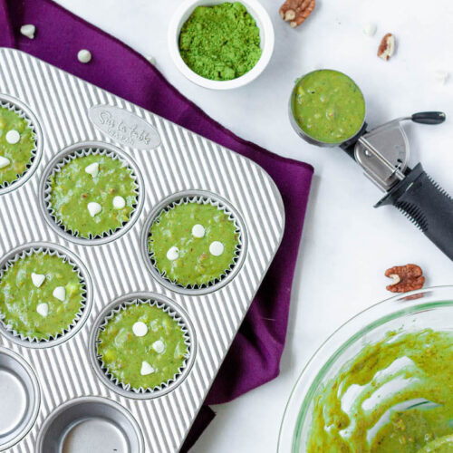 matcha muffin batter in cups before baking