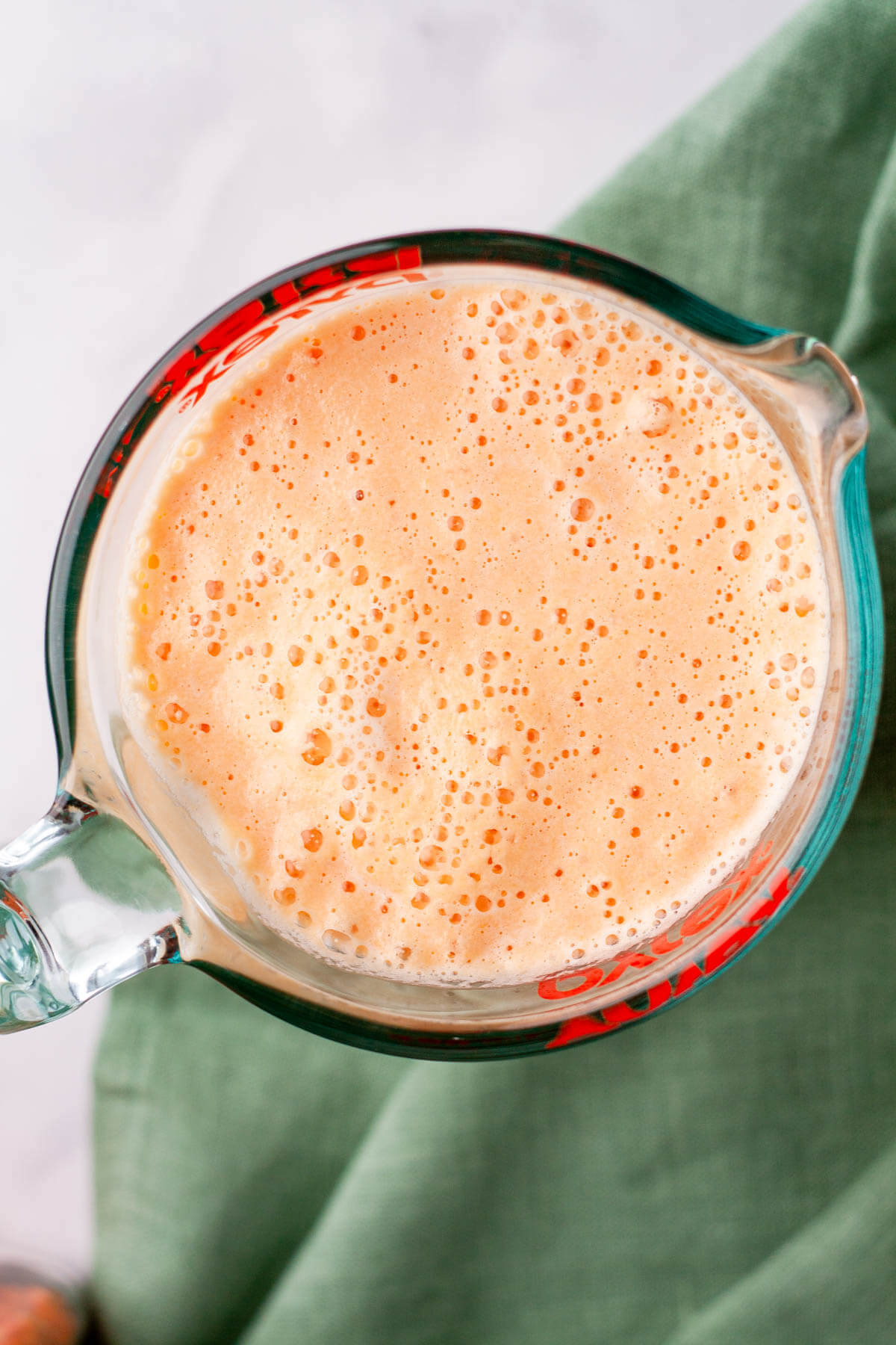 blended red lentils in measuring cup