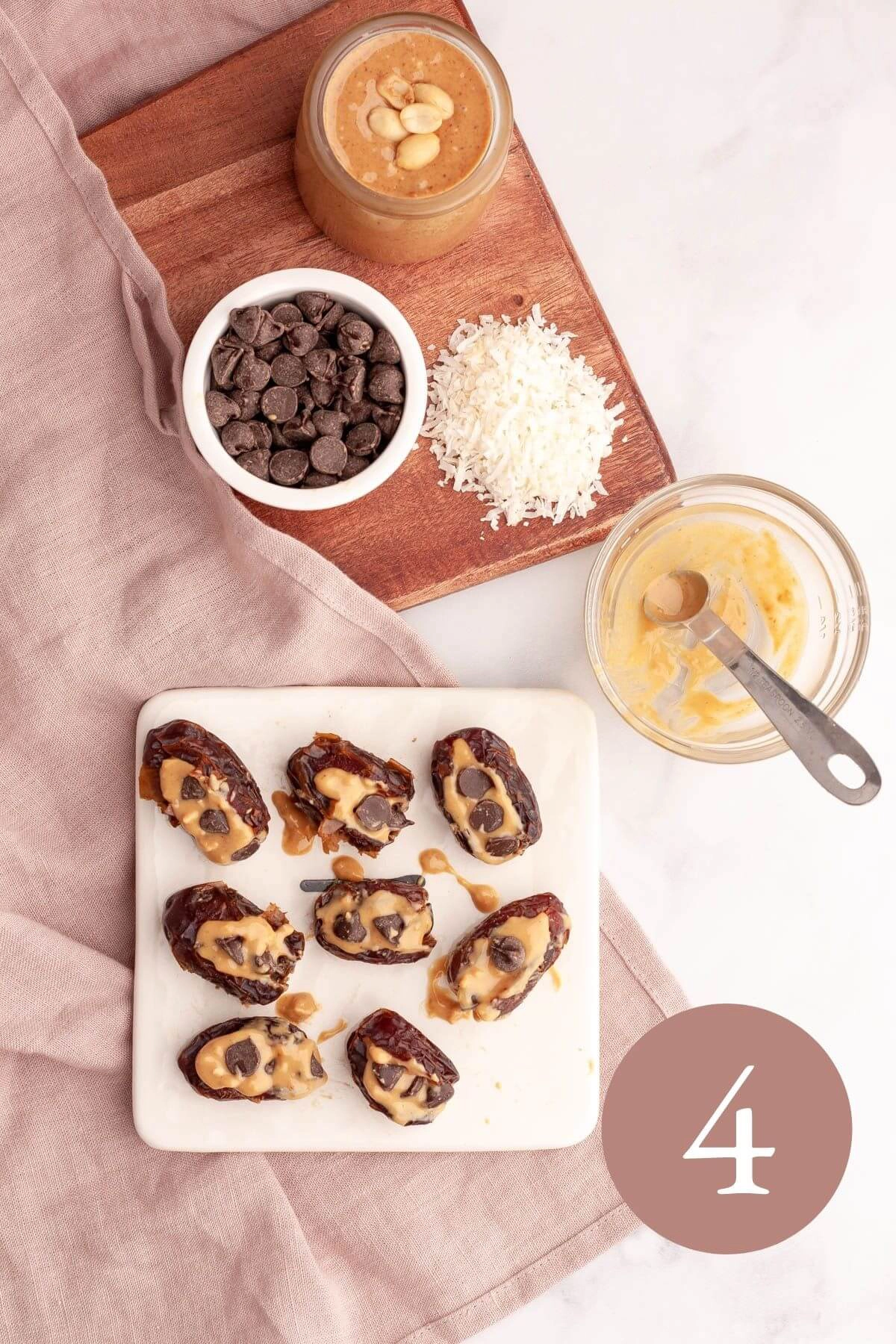 overhead image of peanut butter dates with chocolate chips pressed in peanut butter