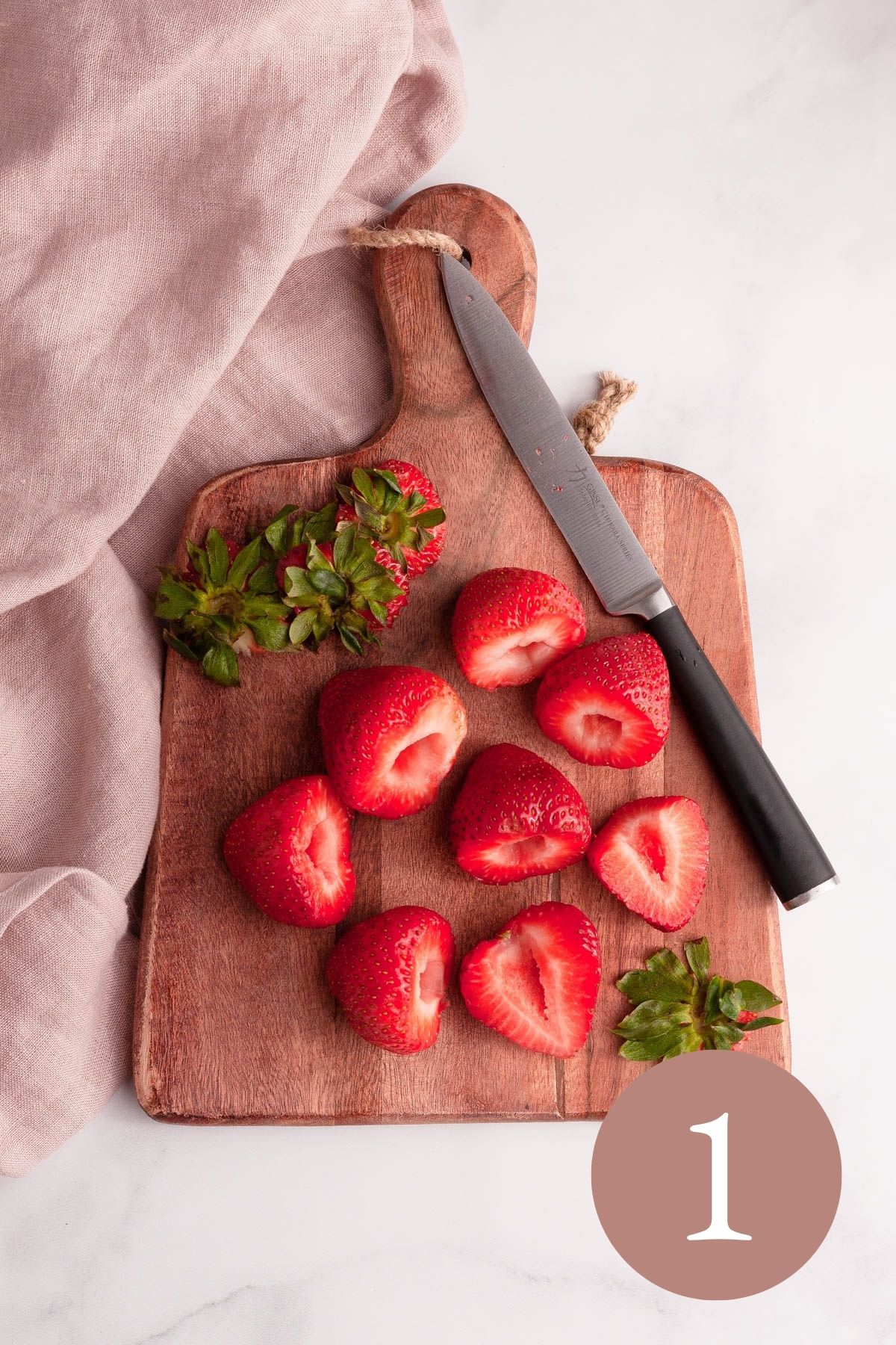 overhead image of hulled strawberries on board