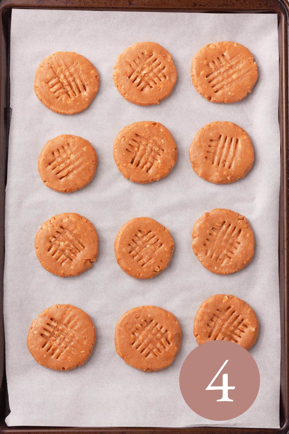 Overhead image of peanut butter cookies on cookie sheet prior to baking.