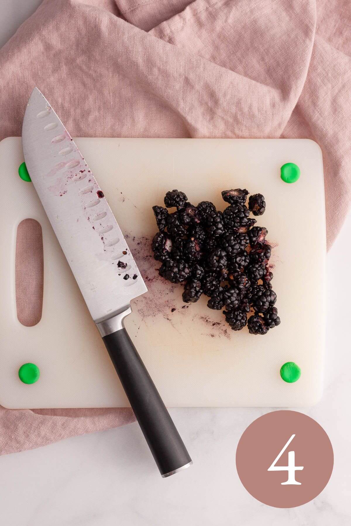 overhead image of chopped blackberries on cutting board