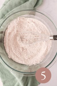 Overhead image of dry ingredients mixed together in glass bowl