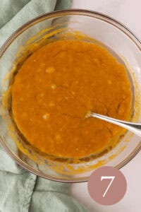 Overhead image of wet ingredients combined in glass bowl