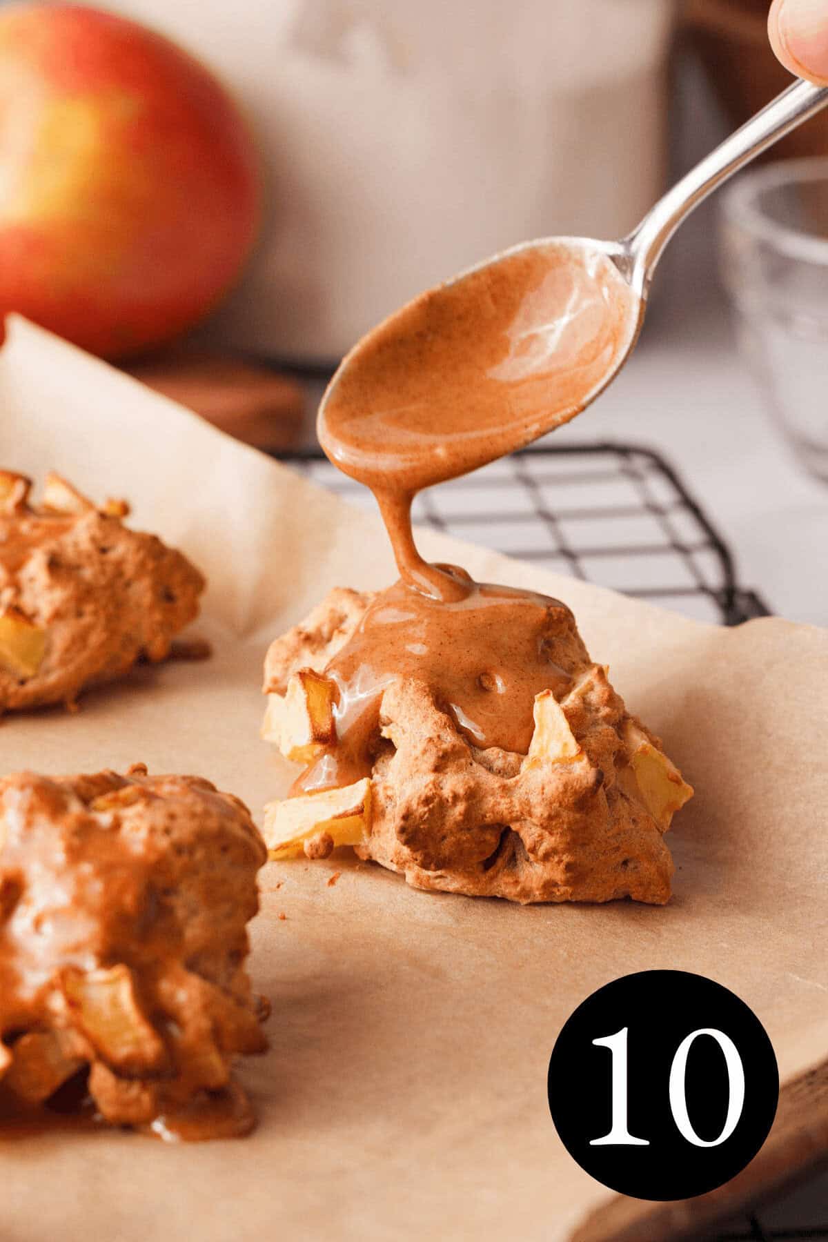 closeup of vanilla cinnamon glaze dripping from spoon onto applesauce fritter