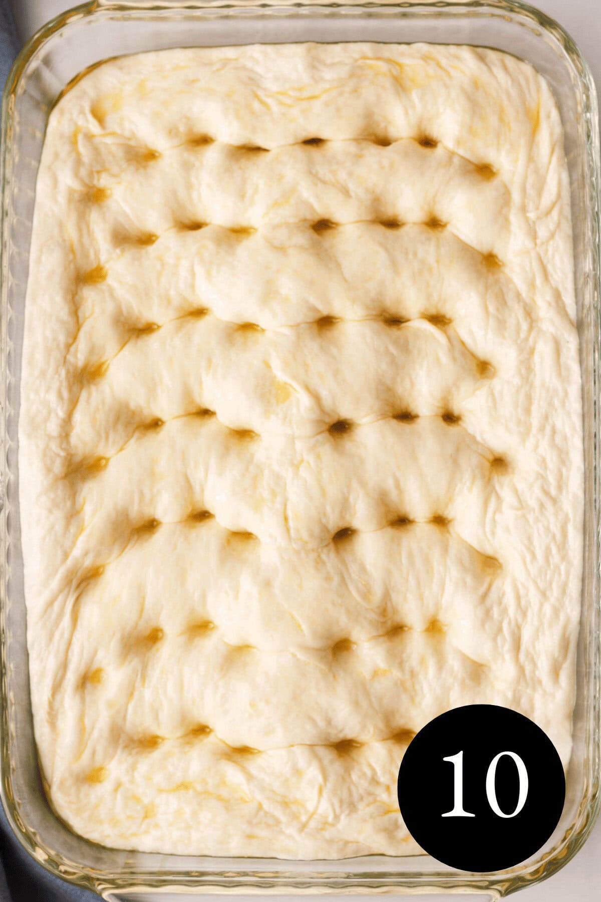 overhead image of dimpled focaccia dough