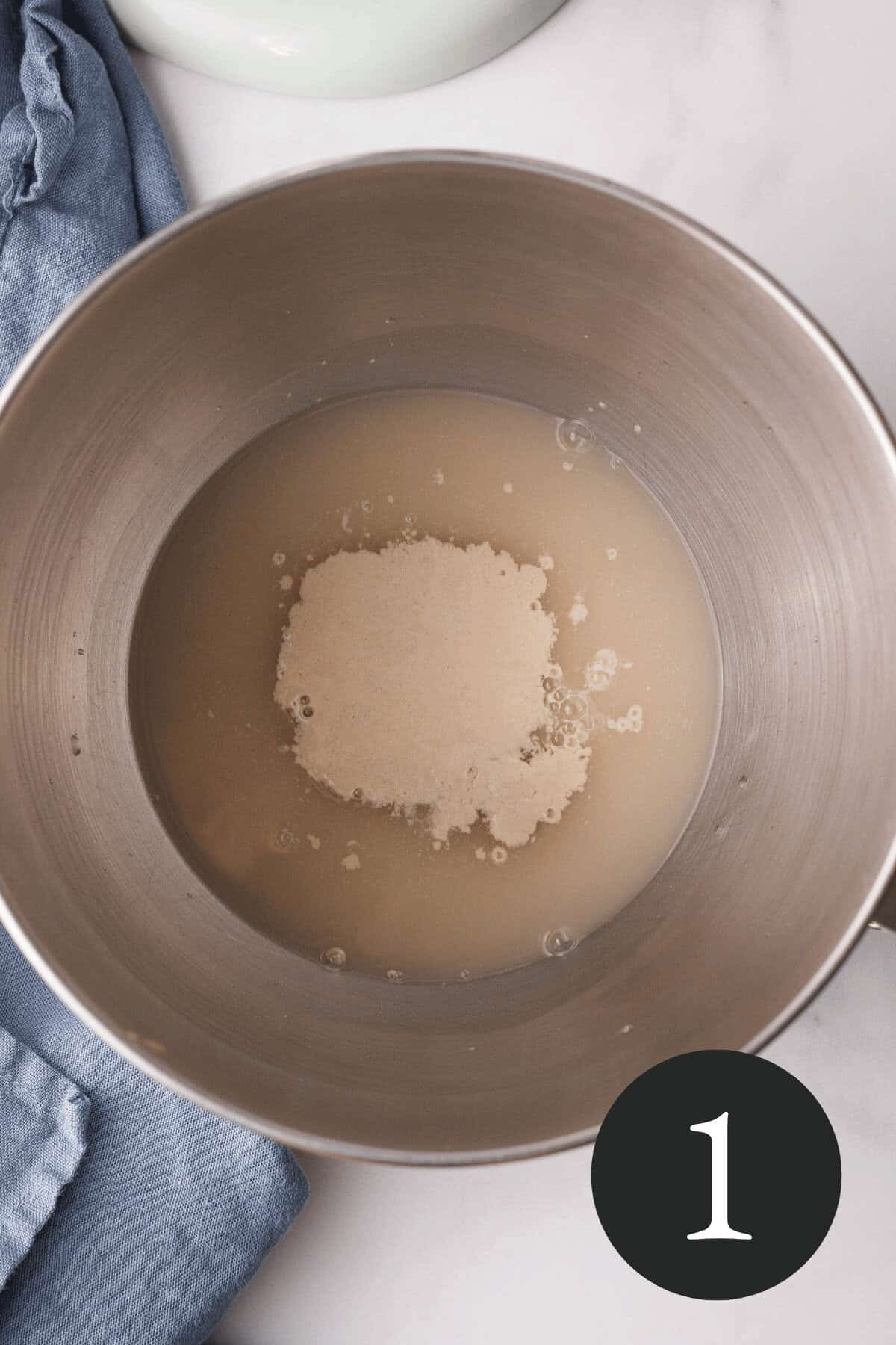 overhead image of yeast water and maple syrup in bowl of stand mixer