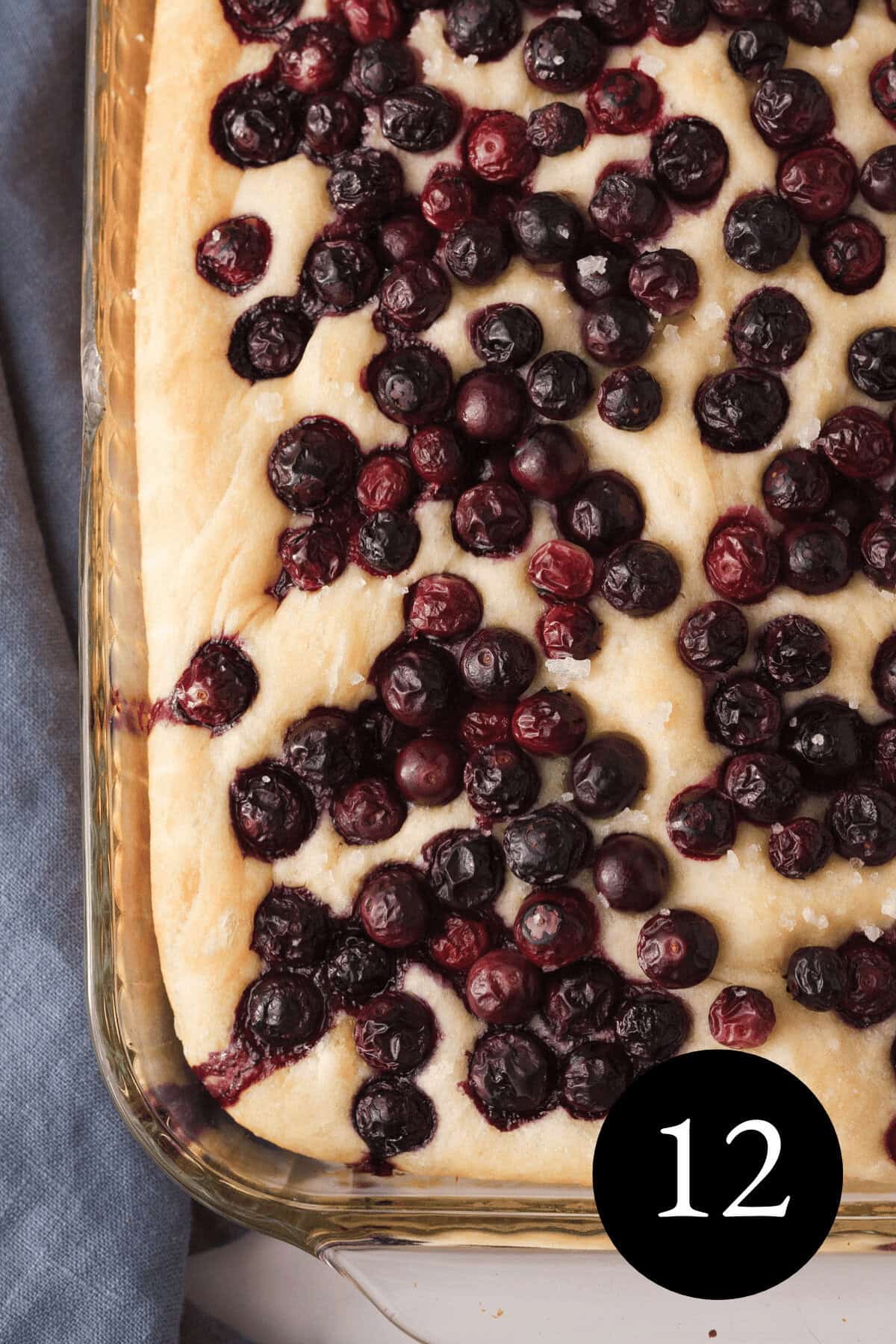 overhead closeup of baked blueberry focaccia bread