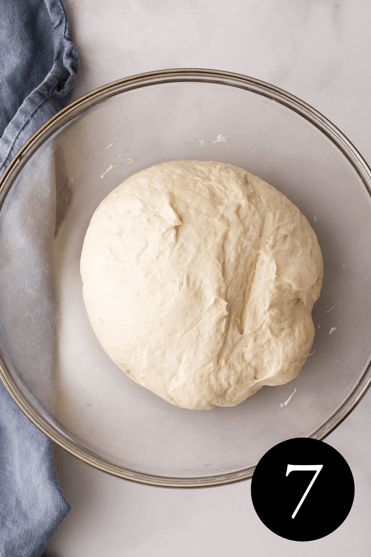 overhead image of focaccia dough after second kneading effort