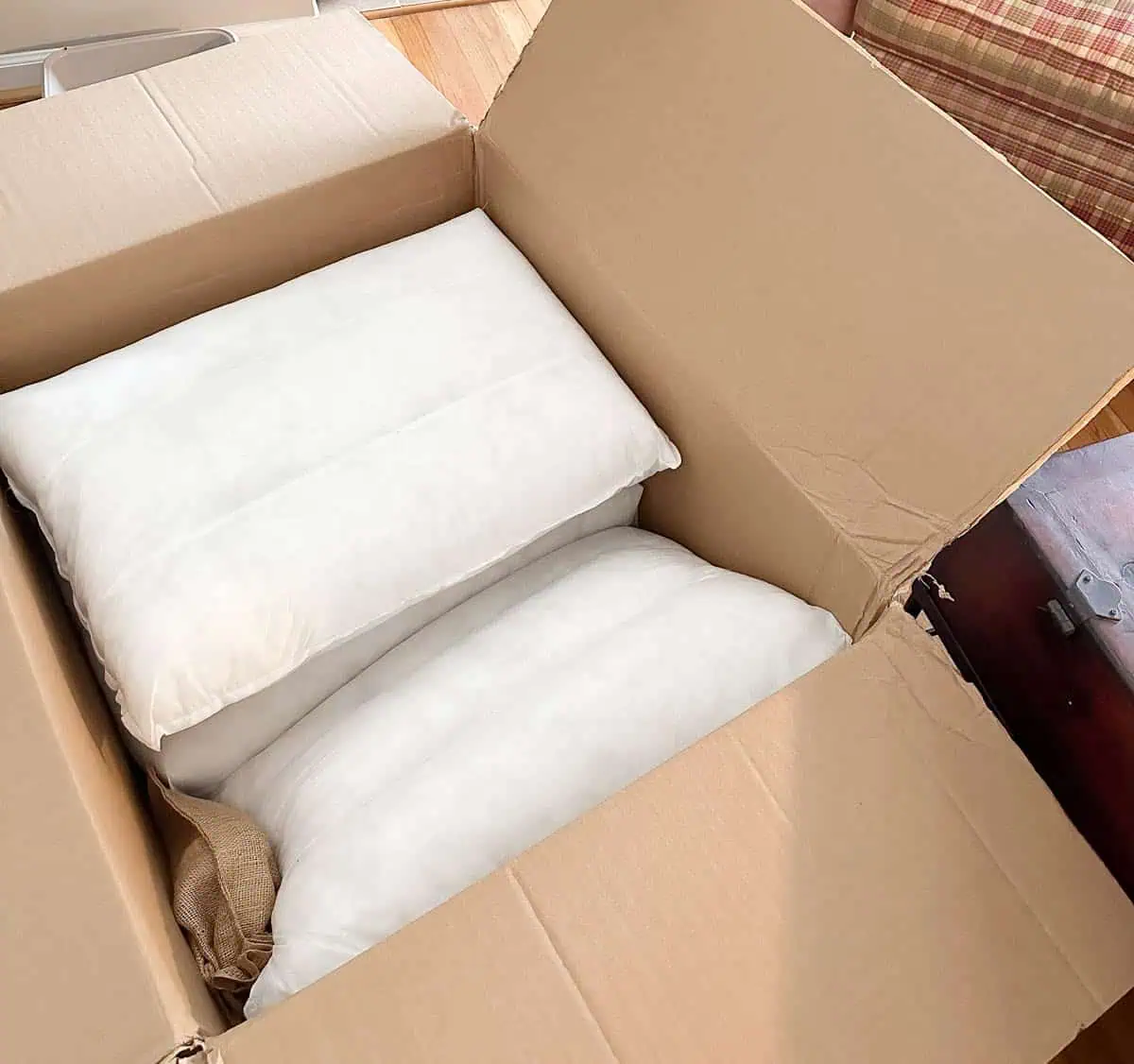 open box with pillows stacked inside