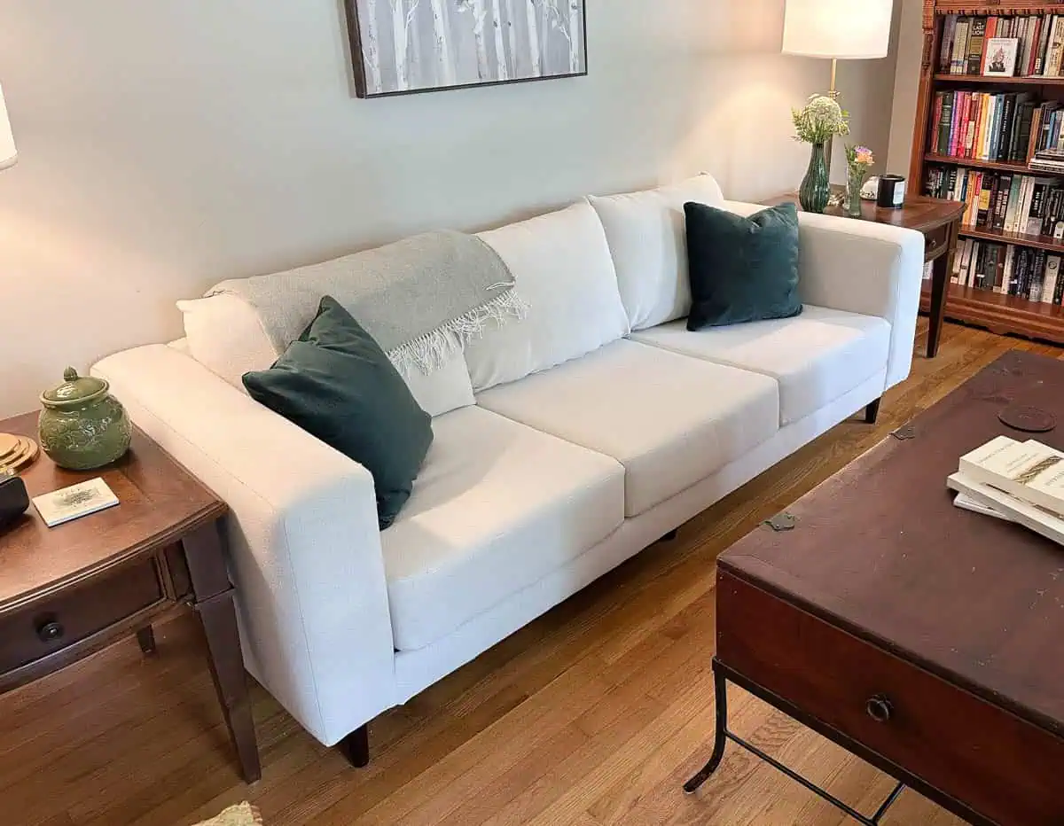 angled from one end of couch showing entire piece in one shot and coffee table pulled away from it