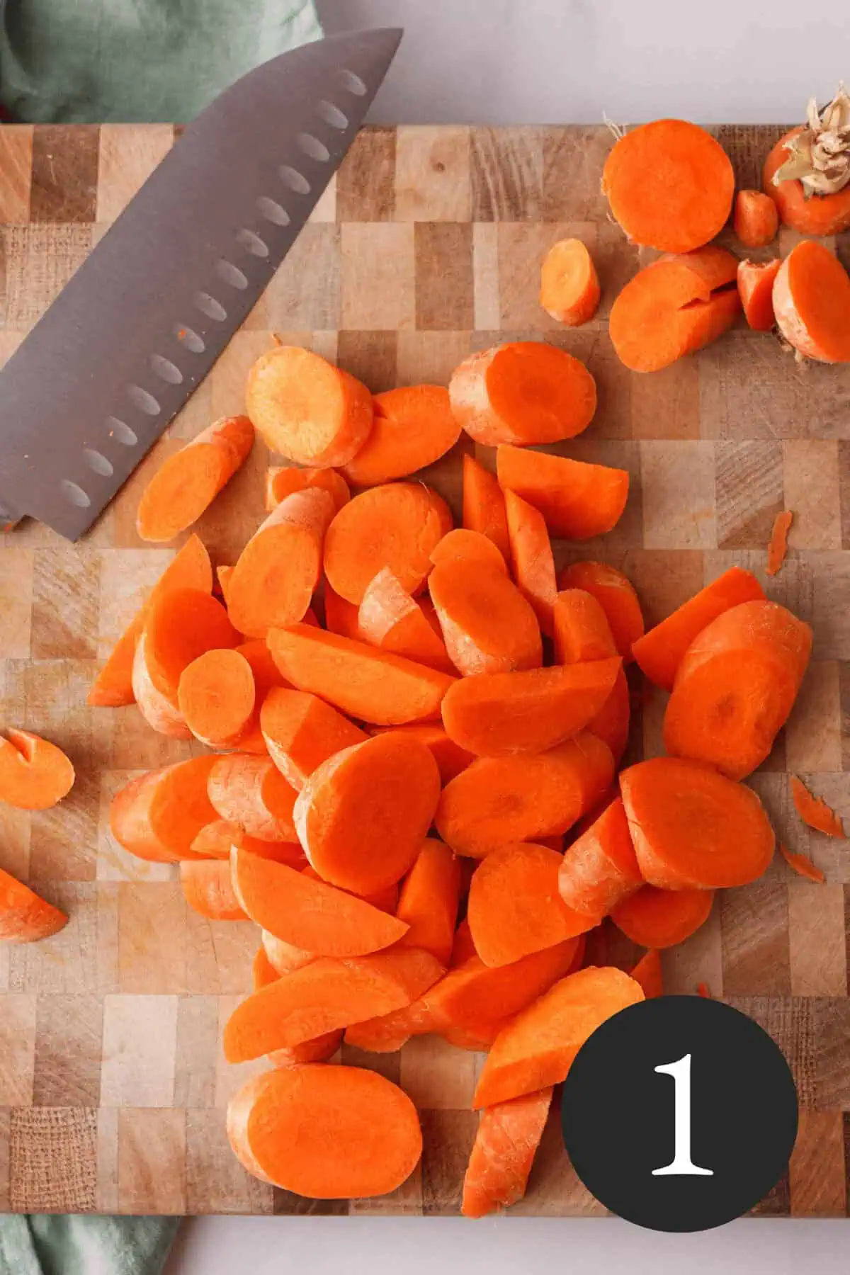 overhead image of sliced carrots on cutting board
