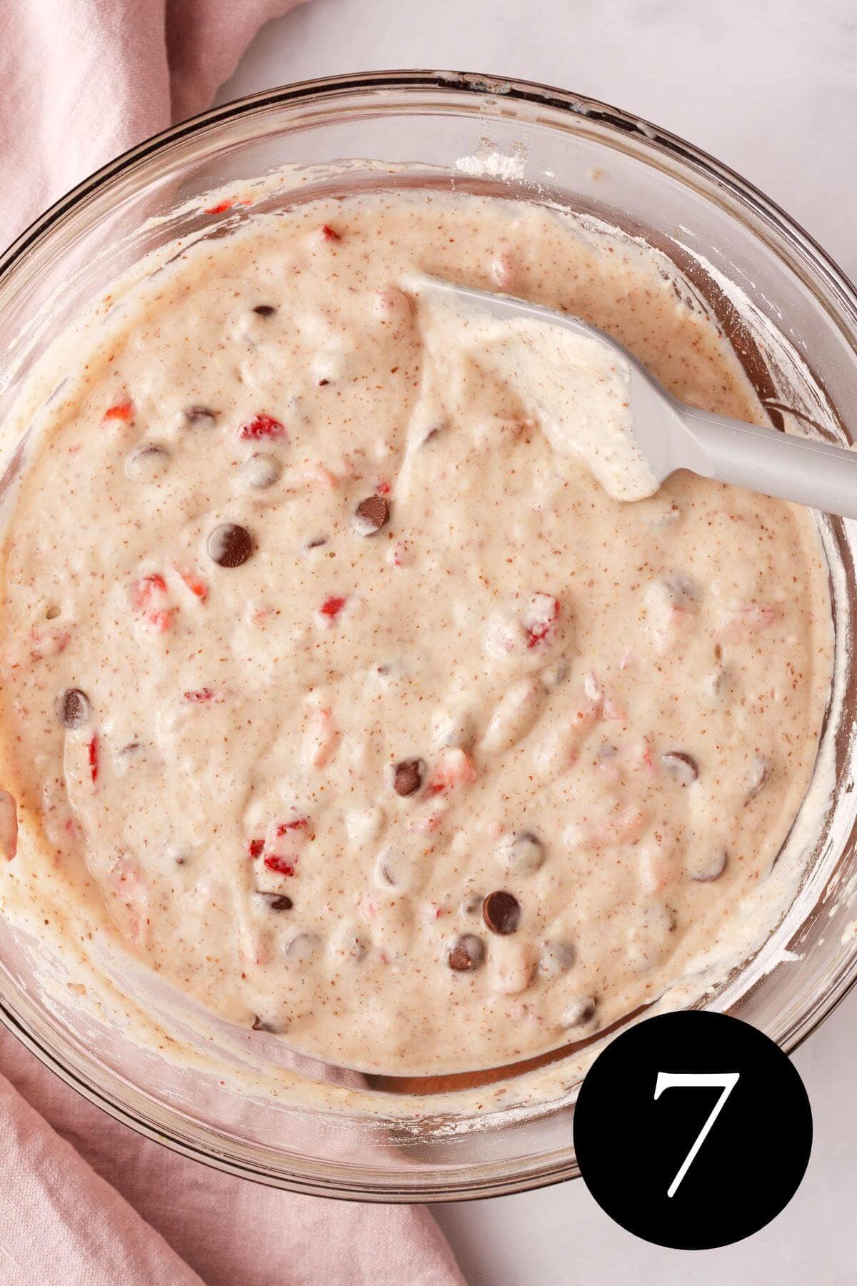 overhead image of strawberries and chocolate chips folded into bread dough