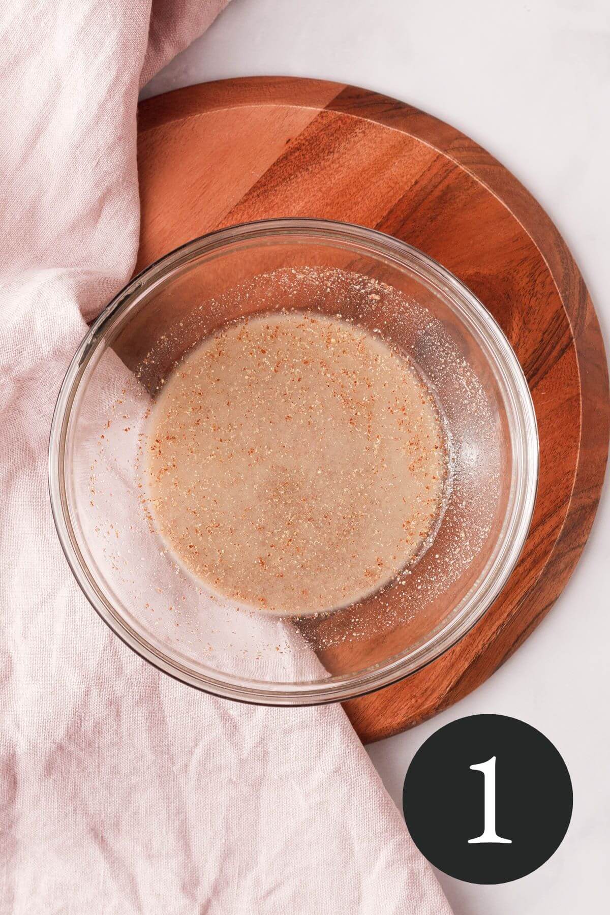 overhead image of flax meal stirred into water and resting on counter
