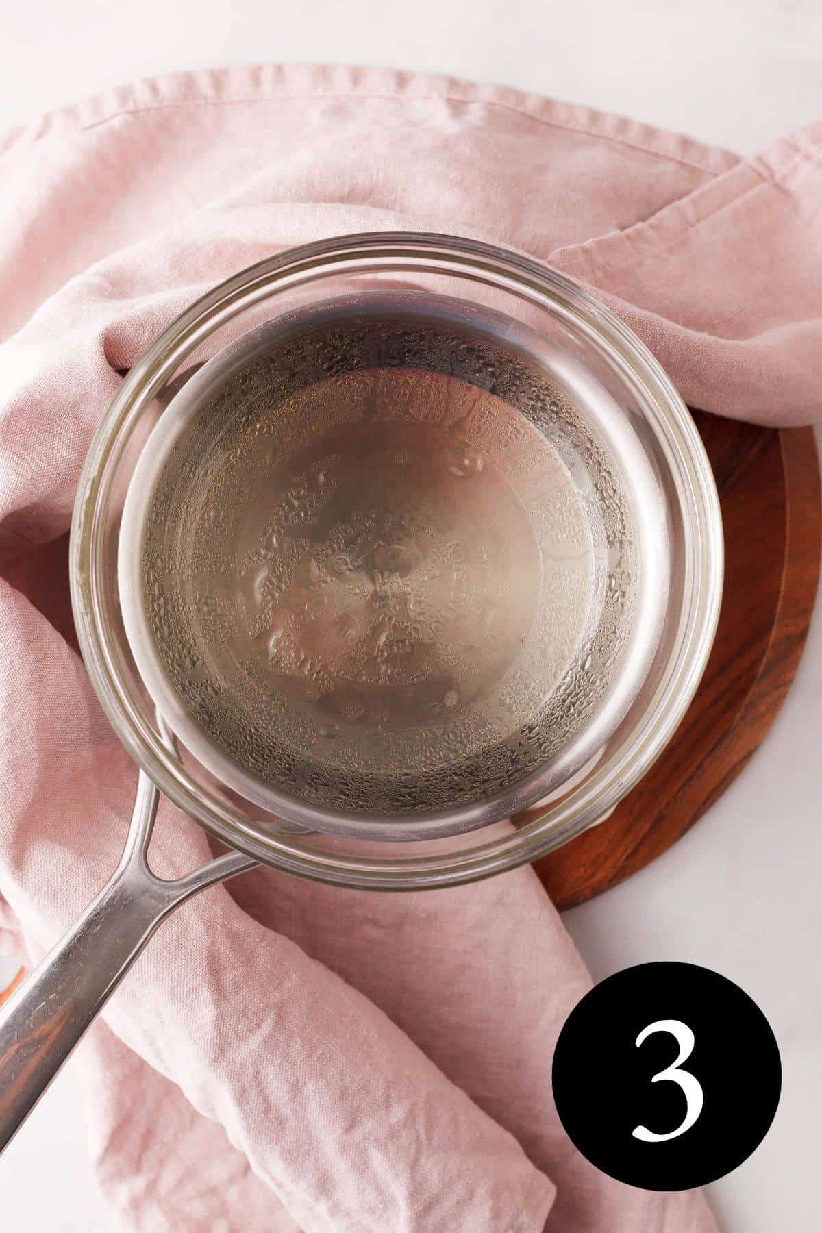 overhead image of melted coconut oil in double broiler