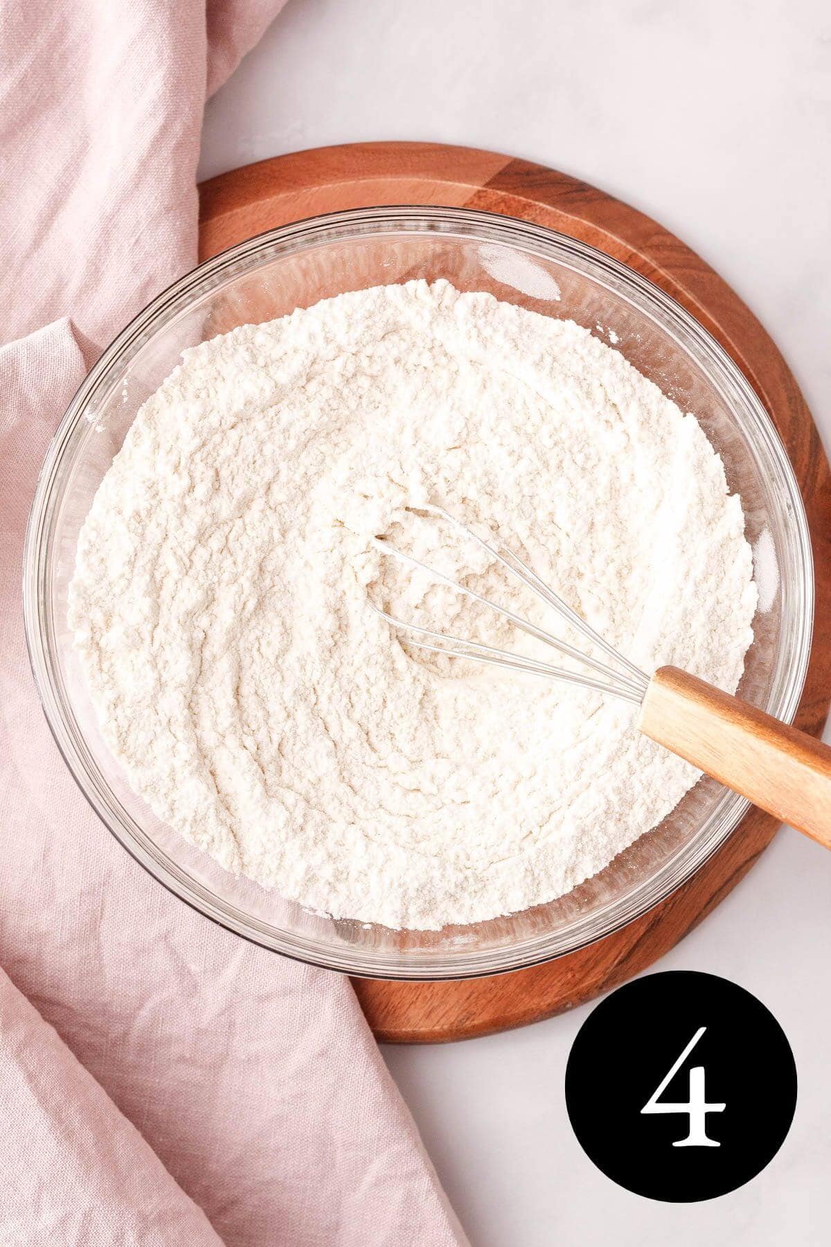 overhead image of whisked dry ingredients in glass bowl