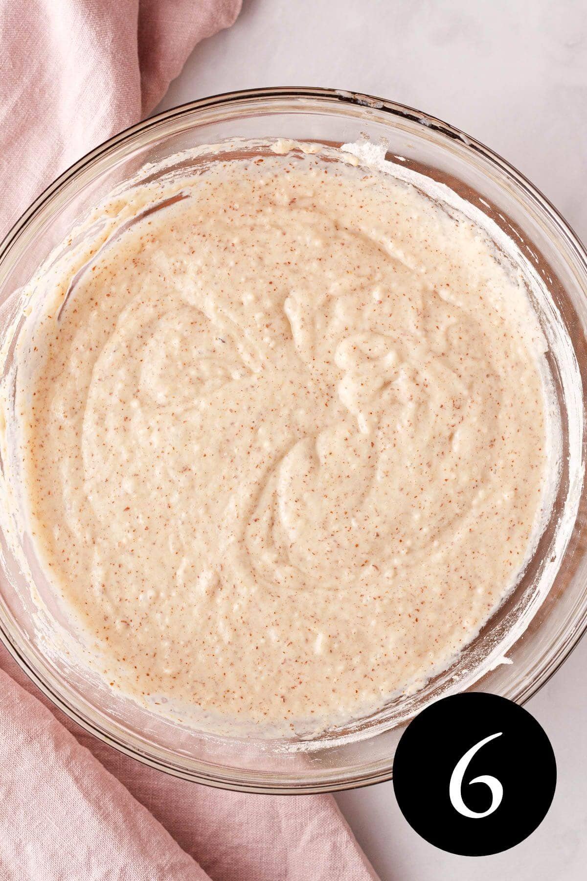 overhead image of combined wet and dry ingredients in glass bowl