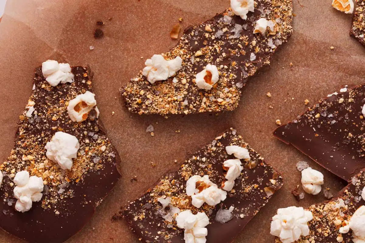 overhead image of popcorn bark broken into pieces on parchment paper