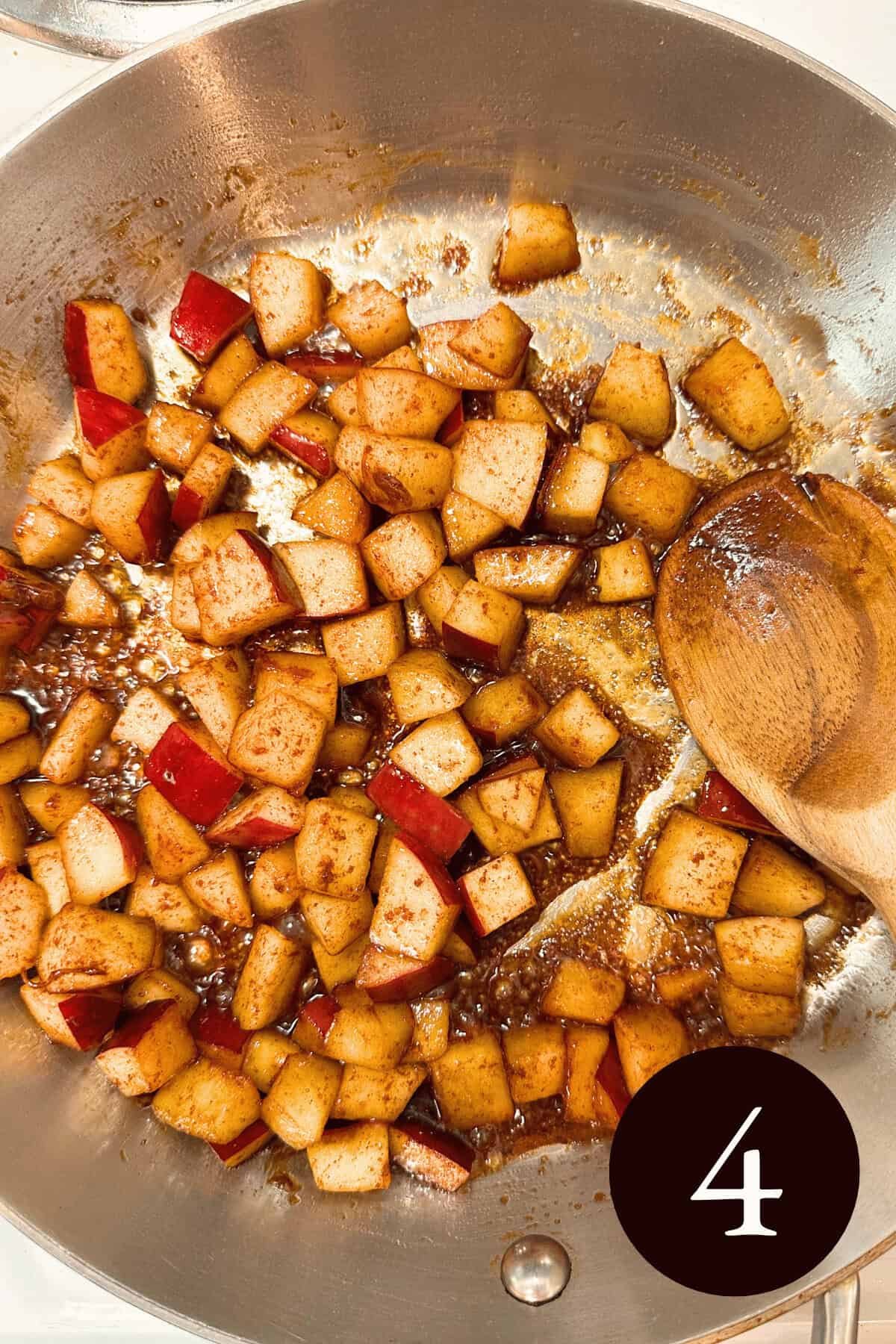 overhead image of apple pieces cooking in the caramel sauce while the sauce is still thick and the number four in the bottom right corner