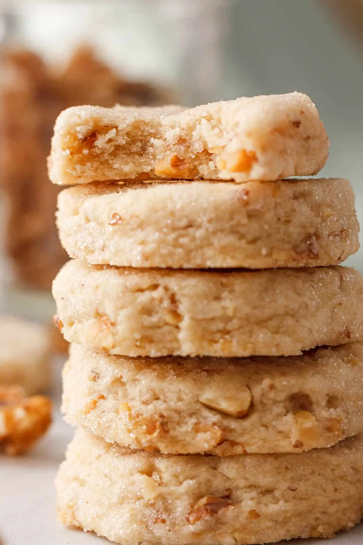 closeup of stacked cookies with bite taken out of the top cookie to show interior texture