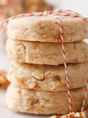 closeup of stacked walnut shortbread cookies