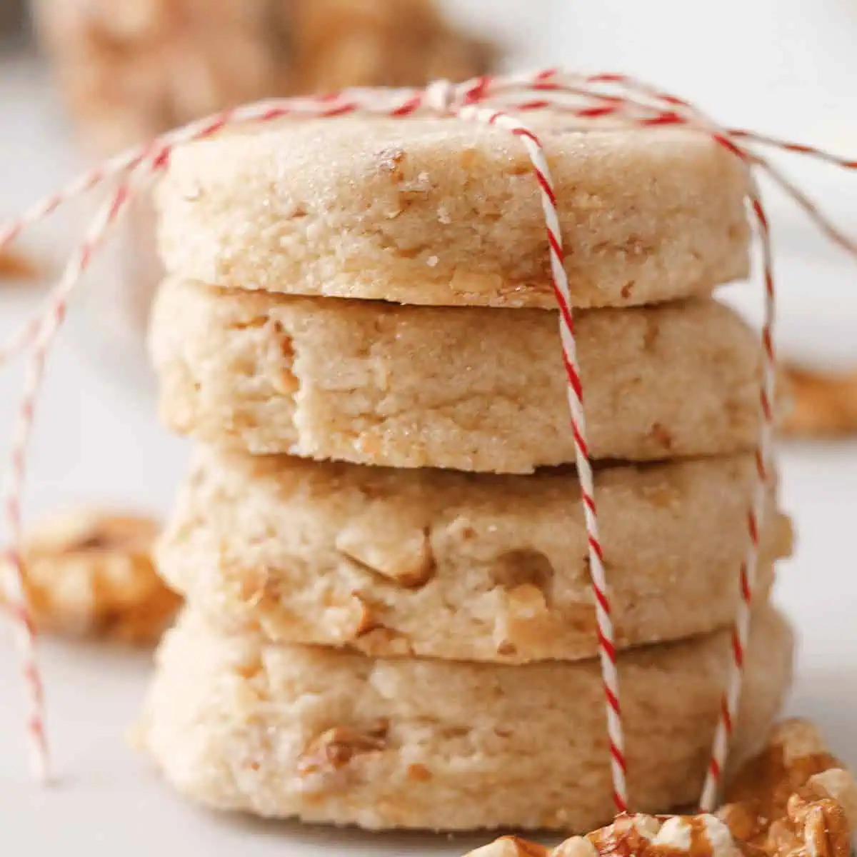 closeup of stacked walnut shortbread cookies