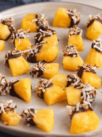 chocolate covered pineapple on plate